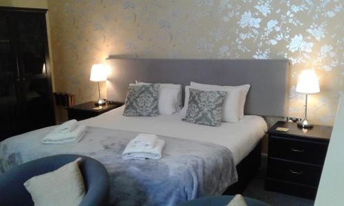 Katil atau katil-katil dalam bilik di Elton Guest House