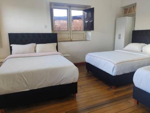 Ένα ή περισσότερα κρεβάτια σε δωμάτιο στο Departamento en Centro histórico de Cusco (PASEO LOS HEROES)
