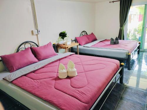 Postel nebo postele na pokoji v ubytování Kohmook​ Money​ House