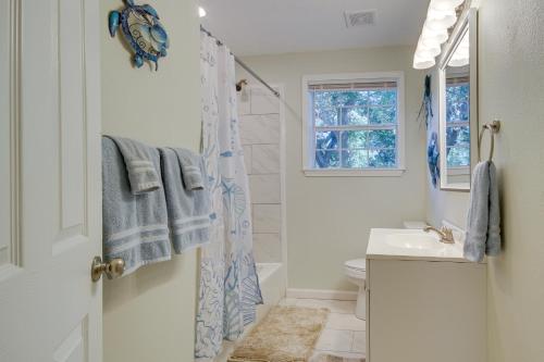 a bathroom with a shower and a sink at Gulfport Home with Fire Pit RVandTrailer Parking in Gulfport