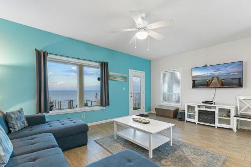 a living room with a couch and a table at Las Joyas Bayview Home in Port Isabel