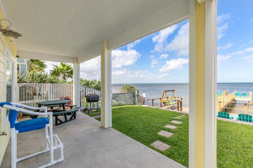 a porch with a view of the ocean at Las Joyas Bayview Home in Port Isabel