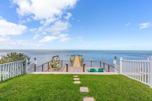 a playground on a deck overlooking the water at Las Joyas Bayview Home in Port Isabel