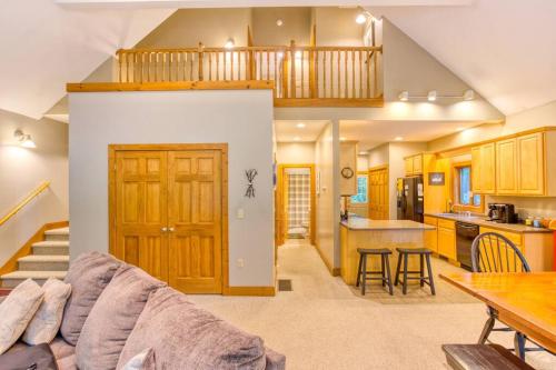 a living room with a couch and a kitchen at Forest Ridge @ Deep Creek Lake in Oakland