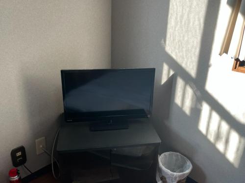 a flat screen tv sitting on a table in a room at Guest house HEART - Vacation STAY 04737v in Hitoyoshi