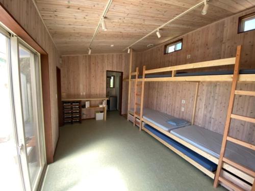 a room with two bunk beds and a window at Kai sou - Vacation STAY 42232v in Tateyama