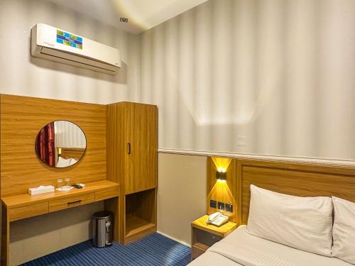 Postel nebo postele na pokoji v ubytování TAMARIND HOTEL