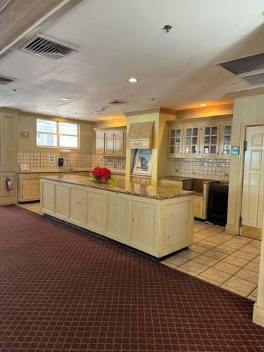 a large kitchen with a large island in a room at Apartment very Close to Disney! in Orlando