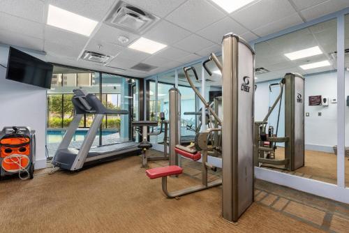a gym with treadmills and elliptical machines at Apartment in Florida near Universal and Intern. Dr in Orlando