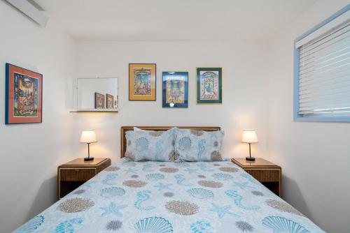 a bedroom with a bed with two night stands at Neahkahnie MCA#50060 in Manzanita