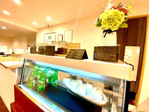 a store with a display case in a store at HOTEL SANDRIVER ISHIGAKIJIMA - Vacation STAY 91476v in Ishigaki Island
