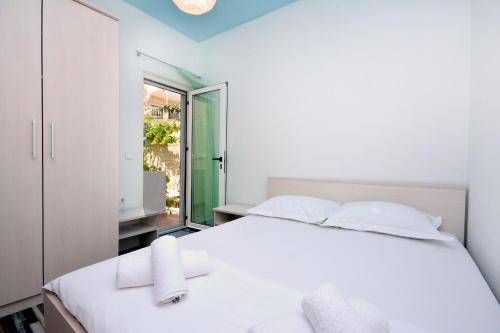 Posteľ alebo postele v izbe v ubytovaní Apartment Joe Light