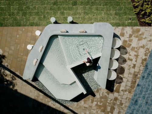 an overhead view of a pool with a person in it at ITOMACHI HOTEL 0 - Vacation STAY 97802v in Saijo