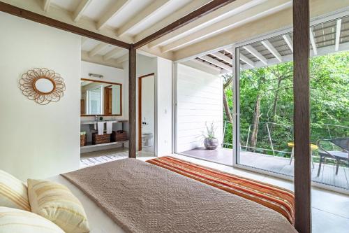 Ένα ή περισσότερα κρεβάτια σε δωμάτιο στο Casa Pochote