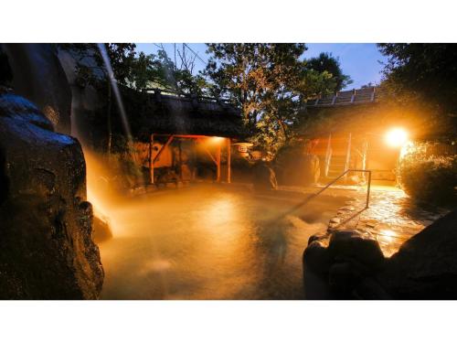 a bridge over a river at night with lights at Asanoya - Vacation STAY 01715v in Shinonsen