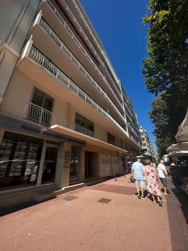 a group of people standing outside of a building at Brand new 2 bdr apartment in Antibes with AC and sea view in Antibes