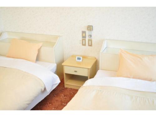 Rúm í herbergi á Green Hotel Rich Tokugawaen - Vacation STAY 02764v