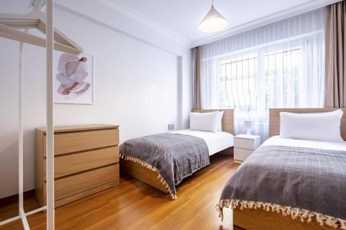 Łóżko lub łóżka w pokoju w obiekcie Magnificent Flat with Central Location in Sisli