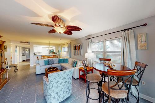 a living room with a couch and a table at Regency Towers W 101 in Pensacola Beach