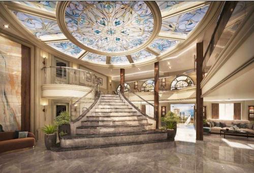 a lobby with a spiral staircase with a ceiling at Nefertari Nile Cruise From Luxor 4&7 Nights, Every Saturday, Monday And Thursday Including tours in Luxor