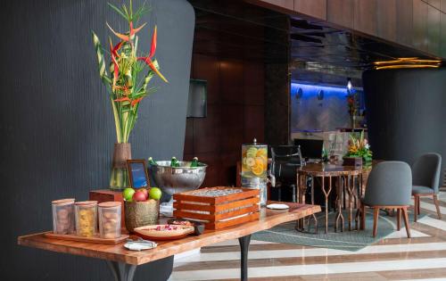 a table with food on it in a room at Radisson Blu Okoume Palace Hotel, Libreville in Libreville