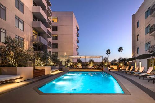 a swimming pool in the middle of a building at Hollywood's Best Location with Panoramic Views! in Los Angeles