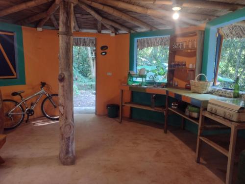 a room with a table and a bike in it at La malokita in San Agustín