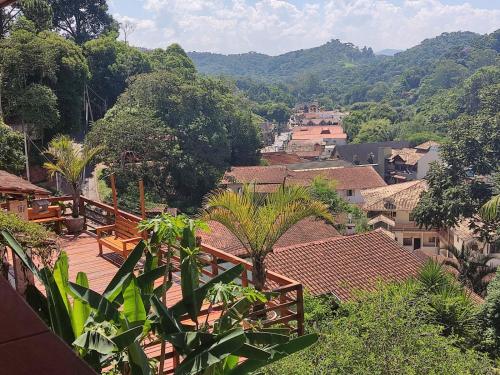 a view of a town with mountains in the background at Pousada Pinhalense in Santo Antônio do Pinhal