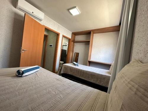 Postel nebo postele na pokoji v ubytování Flat Aconchegante a 200m do Mar - Praia Marceneiro