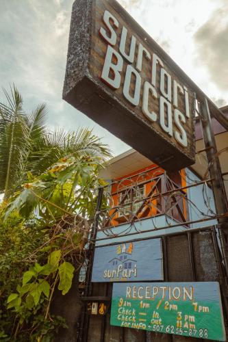 a sign for a sunoco restaurant on the side of a building at Surfari Bocas in Bocas del Toro