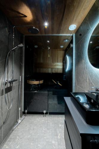 a bathroom with a shower and a sink at Arctic Iglu Levi in Levi