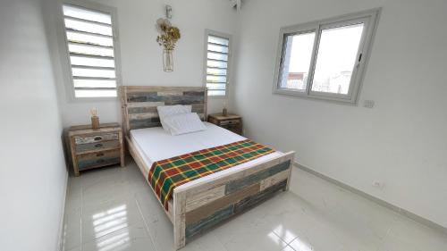 Postel nebo postele na pokoji v ubytování LE MANGO 'Lodge