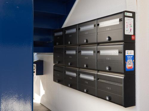 a bunch of lockers in a room at Tabist A Mirai Oji in Tokyo