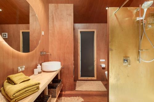 a bathroom with a sink and a shower at The Shed Guest House in Mount Maunganui