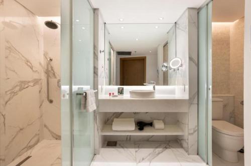 a bathroom with a sink and a toilet and a shower at Hotel Nacional in Rio de Janeiro