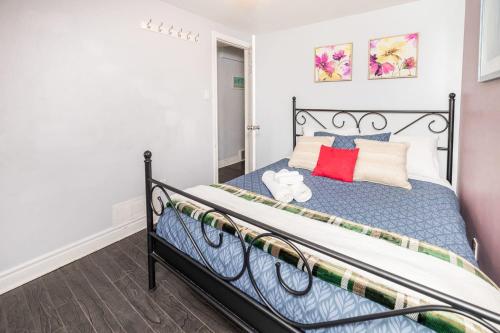 a bedroom with a bed with a black frame at 2BR Apartment with Private Rooftop Terrace in Ottawa