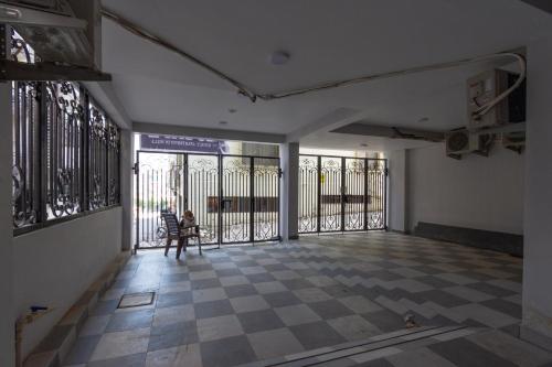 a room with wrought iron gates and a checkered floor at 2BHK luxury Escape in rishikesh in Rishīkesh