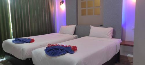Katil atau katil-katil dalam bilik di Rimnatee Resort Trang