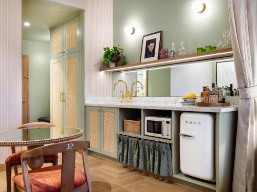 Kuchyň nebo kuchyňský kout v ubytování Palihouse Hyde Park Village
