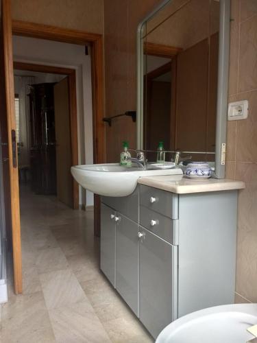 a bathroom with a sink and a mirror at Casa Vacanze Arba Girasole in Girasole