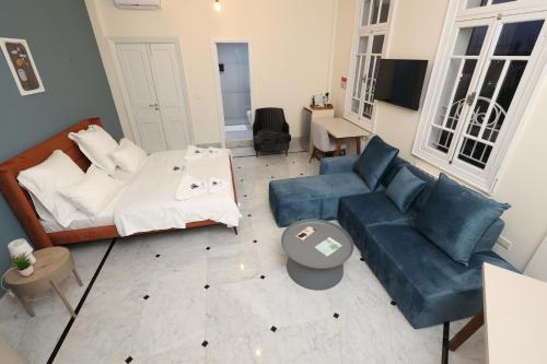 a living room with a bed and a couch at THE GEM BOUTIQUE HOTEL in Beirut