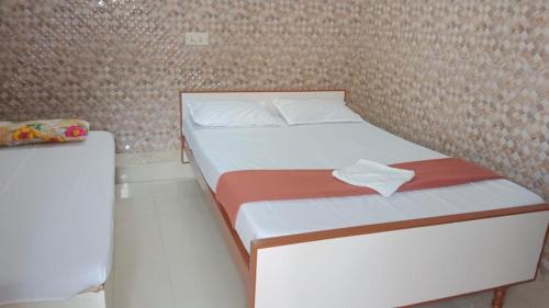 Posteľ alebo postele v izbe v ubytovaní CATCH A WAVE BUDGET STAY