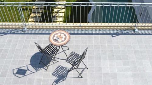 two chairs and a frisbee sitting in a pool at Percebes Exclusive B&B in Cutrofiano