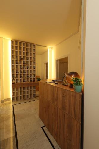 a large room with a wine cellar with a wooden counter at THE GEM BOUTIQUE HOTEL in Beirut