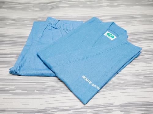 a blue shirt sitting on top of a wooden table at Hotel Route Inn Miyakonojo in Miyakonozyō
