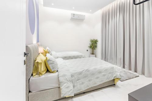 Postel nebo postele na pokoji v ubytování Amber Hospitality - Al Qairawan