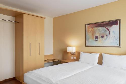 Postel nebo postele na pokoji v ubytování Hotel Amaris
