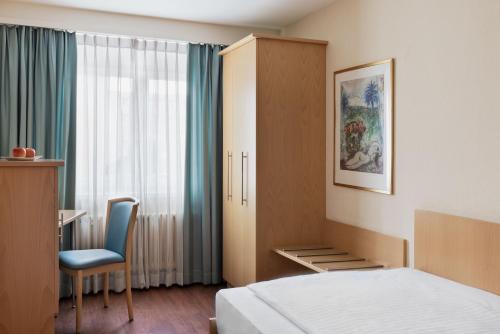 Postel nebo postele na pokoji v ubytování Hotel Amaris