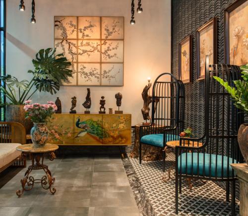 a living room with two chairs and a table at Aaron Boutique Hotel in Nha Trang