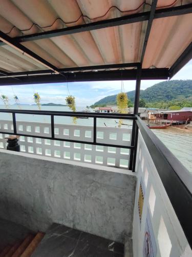 a balcony with a view of the water at Poohry Seaview in Ko Lanta
